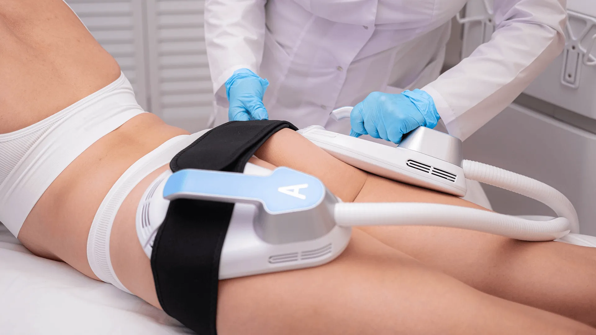 A woman receiving an EMSCULPT NEO treatment.