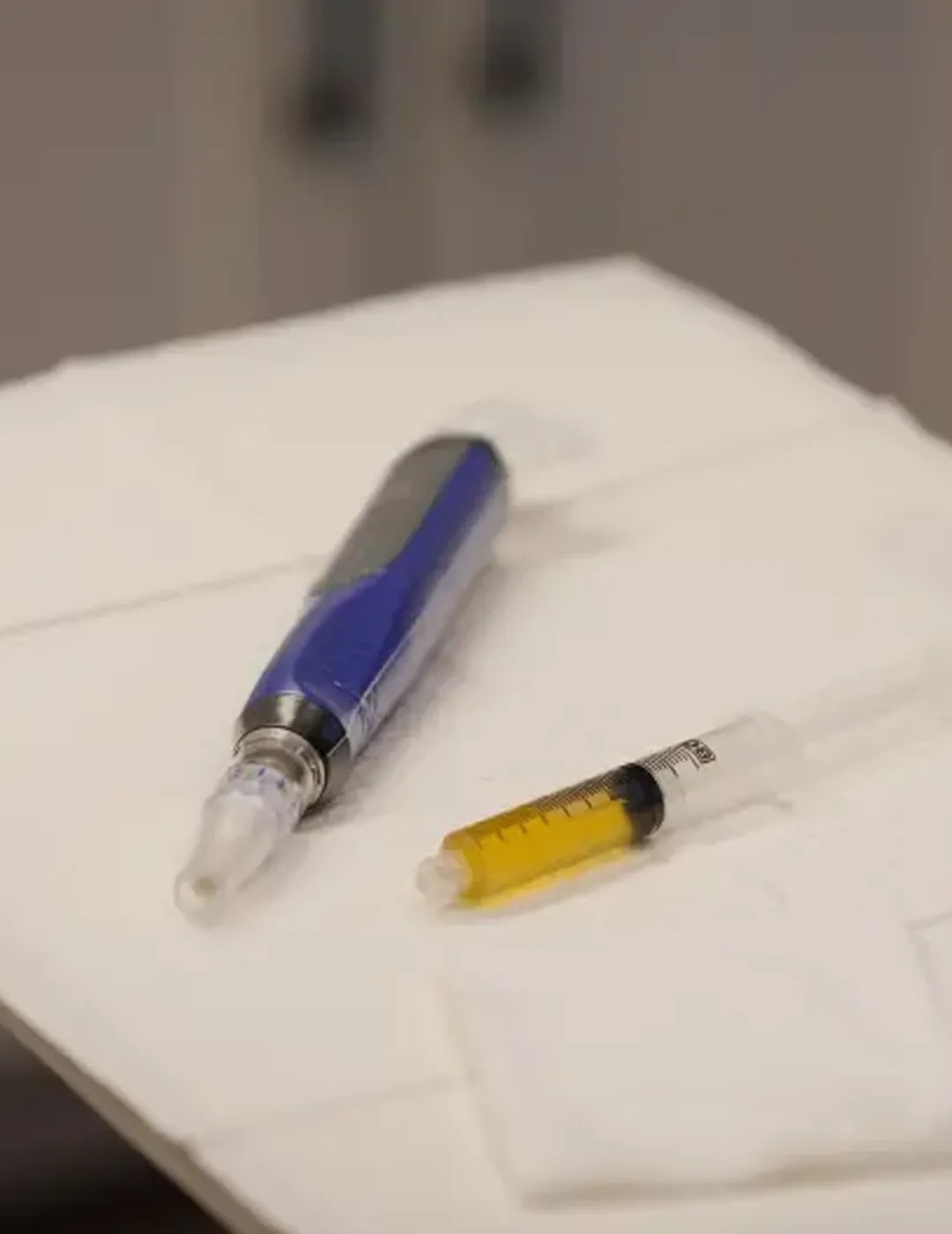 A close-up of a microneedling tool.