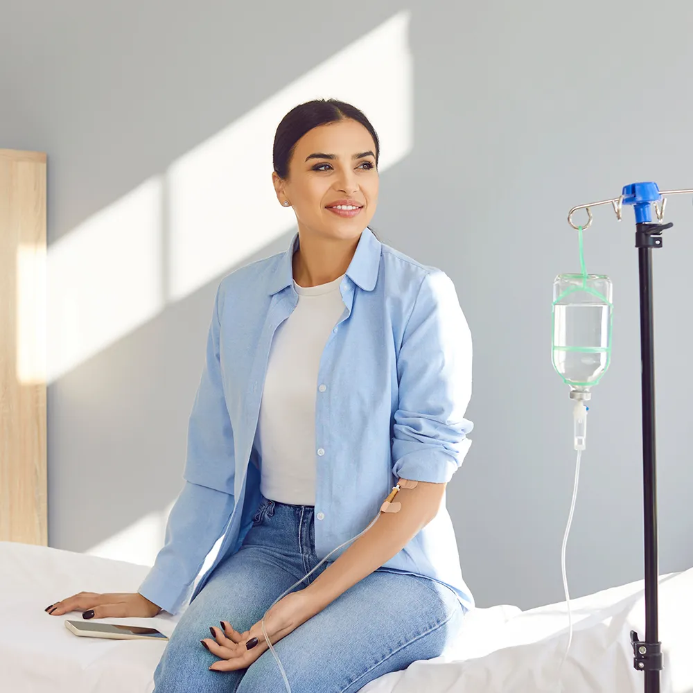 A woman receiving IV therapy.