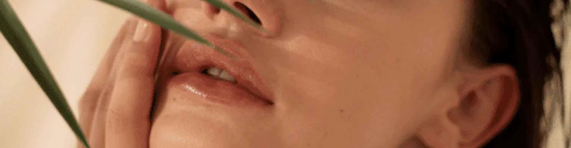 A portrait of a woman showing her face.