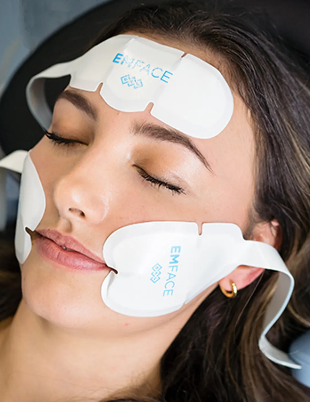 A patient receiving an EMFACE treatment.