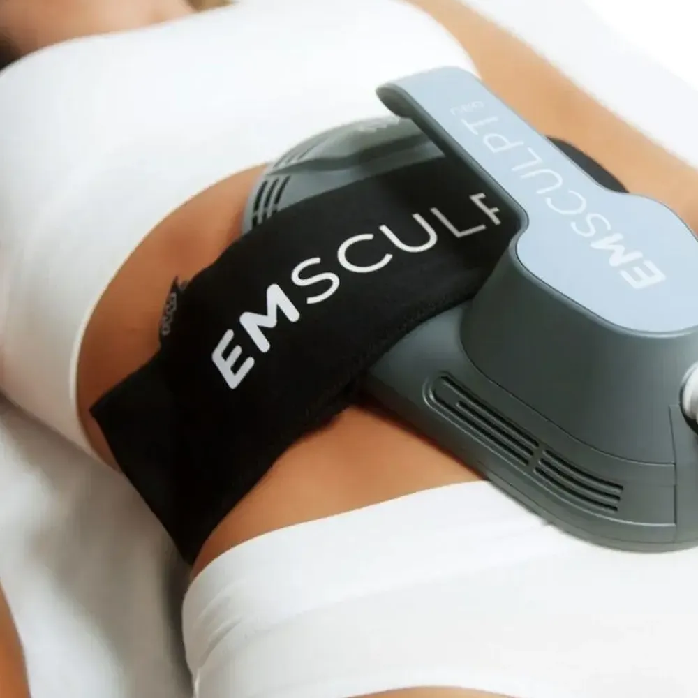 A woman receiving an EMSCULPT NEO treatment.