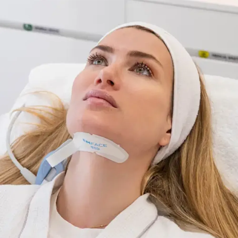 A patient receiving an EMFACE treatment.