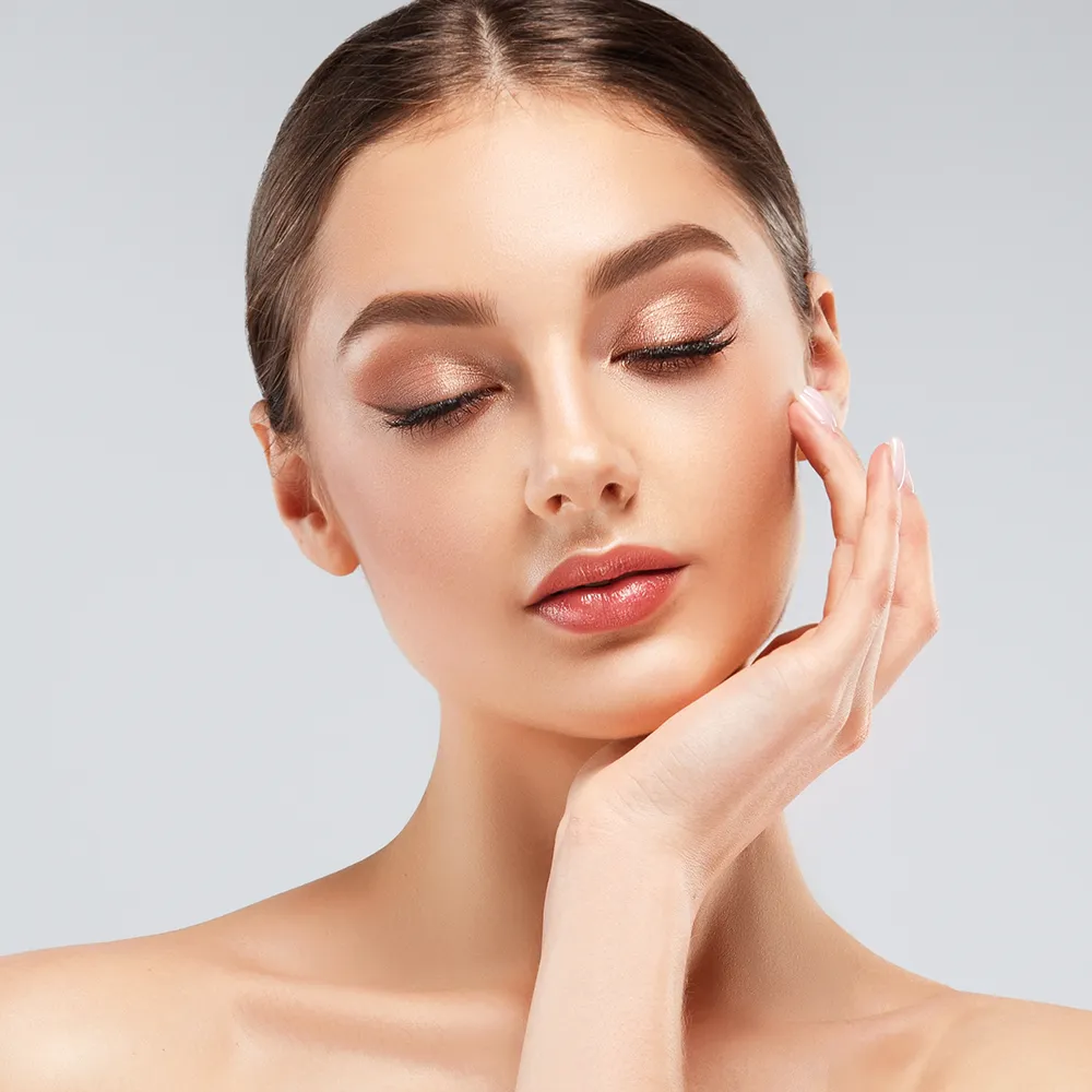 A portrait of a woman showing her face.